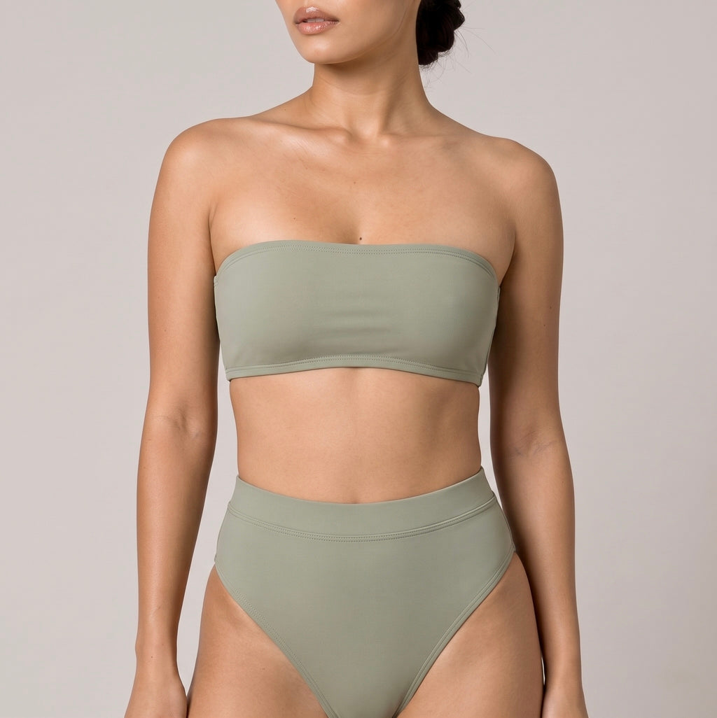Close-up of the sage green Fitfigura Sculpt Bikini – Contour Form showing the bandeau neckline and smooth sculpted finish of the bikini top.