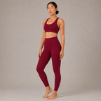 Full-body view of the burgundy Fitfigura Sculpt Butterlift Leggings styled with a matching activewear top.