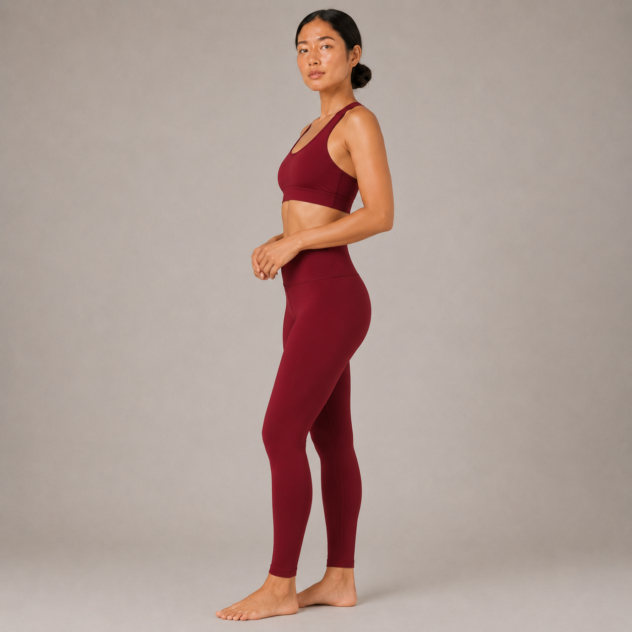Side view of the Fitfigura Sculpt Butterlift Leggings in burgundy, showing the high-waisted fit and smooth leg silhouette.