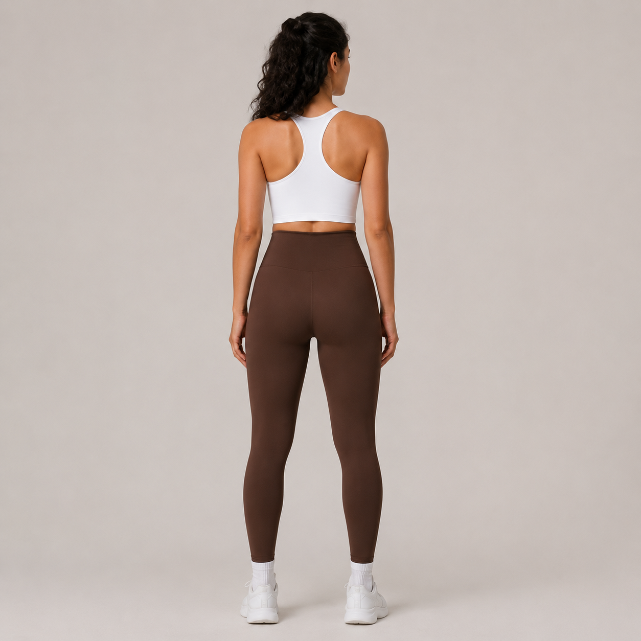 Back view of the dark brown Fitfigura Sculpt Legging, showing the rear fit and full-length legging shape.