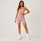 Model posing in the Fitfigura Sculpt Short 6” – Performance Sculpt Form in light pink, showing the high-rise waist and sleek performance fit.