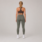 Back view of the olive green Fitfigura Seamless Legging, showing the rear fit and full-length legging shape.