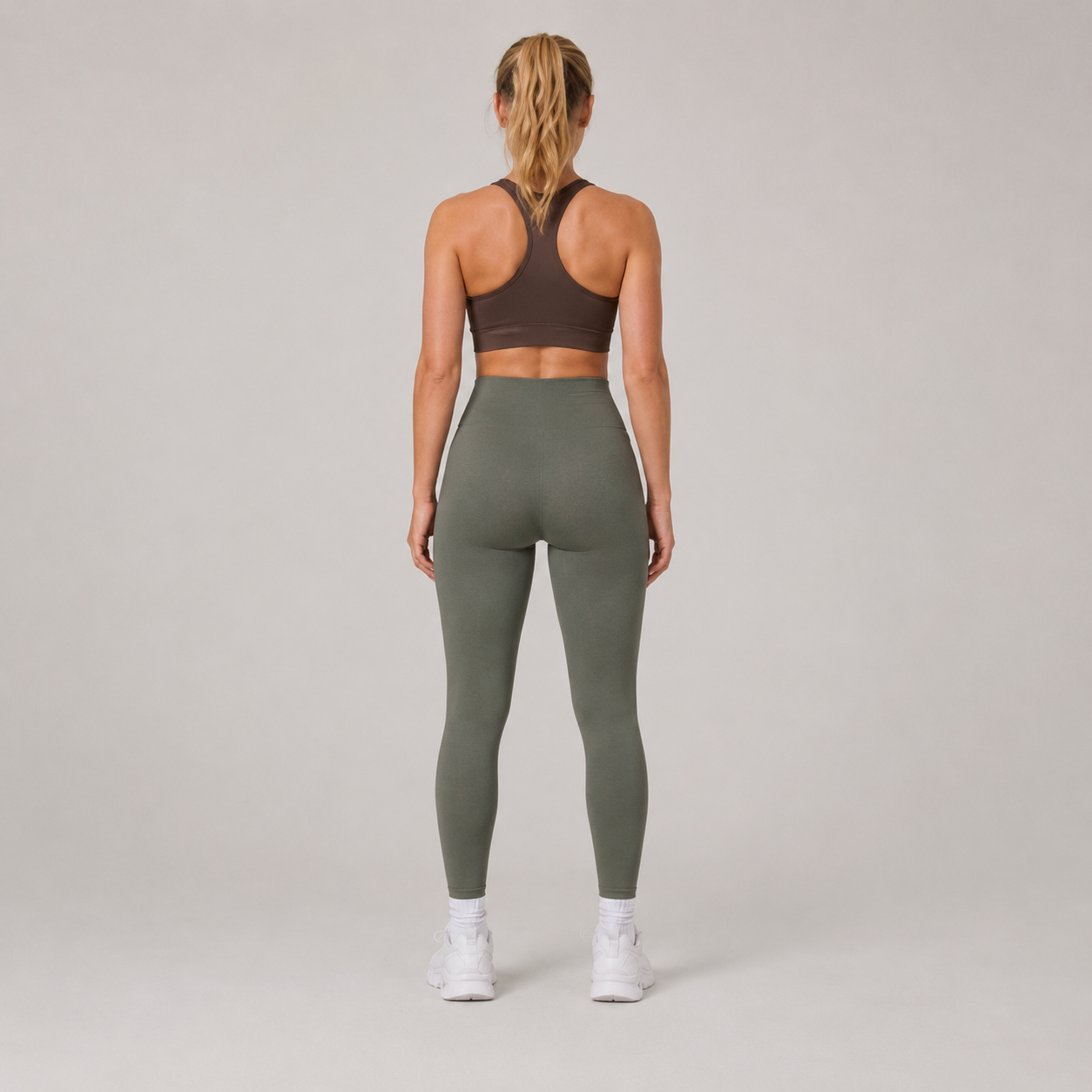 Back view of the olive green Fitfigura Seamless Legging, showing the rear fit and full-length legging shape.