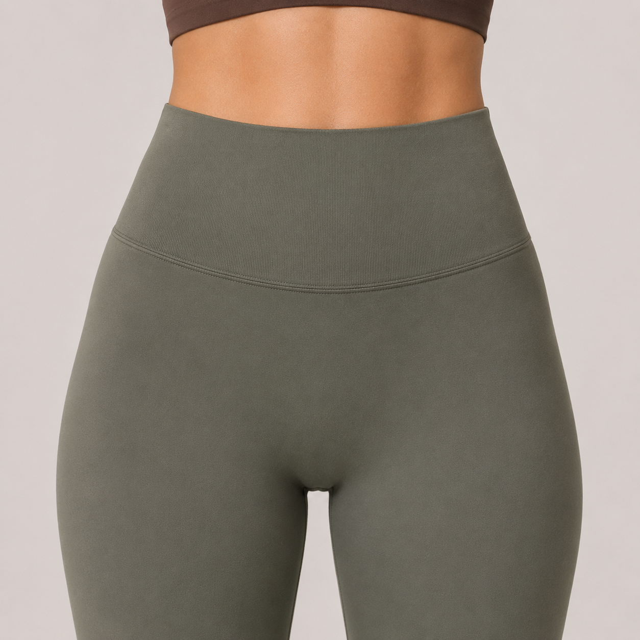 Close-up of the olive green Fitfigura Seamless Legging showing the high-rise waistband and sculpting fit.
