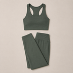 Flat lay of the Fitfigura Seamless Set – Performance Sculpt Form in sage green, featuring a racerback crop top and matching leggings.
