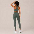Rear angled view of the sage green Fitfigura Seamless Set – Performance Sculpt Form, highlighting the smooth sculpted fit and matching leggings.