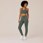 Full-body studio view of the sage green Fitfigura Seamless Set – Performance Sculpt Form, showing the coordinated crop top and leggings.