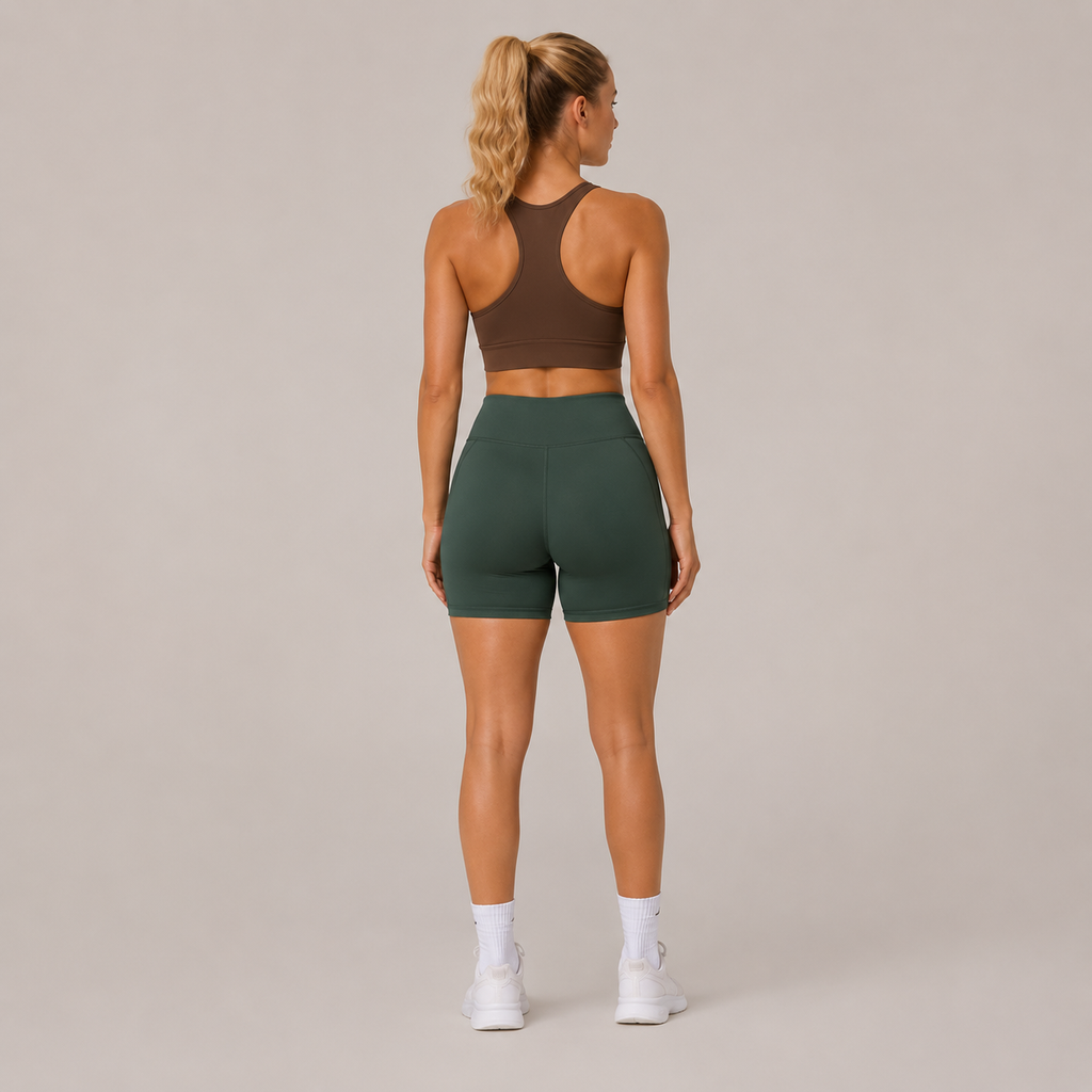 Back view of the dark green Fitfigura Seamless Short – Athletic Form, showing the high-rise waistband and fitted rear silhouette.