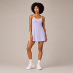 Angled studio view of the light purple Fitfigura Serve Dress – Elite Court Form, highlighting the slim straps and clean court-ready silhouette.