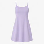 Flat lay of the Fitfigura Serve Dress – Elite Court Form in light purple, showing the slim straps, scoop neckline, and flared hem.