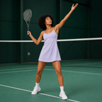 Tennis action view of the light purple Fitfigura Serve Dress – Elite Court Form, showing movement and athletic styling on court.