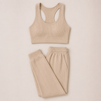 Flat lay of the Fitfigura Soft Ribbed Set – Luxe Comfort Form in cream, featuring a sleeveless crop top and matching jogger pants.