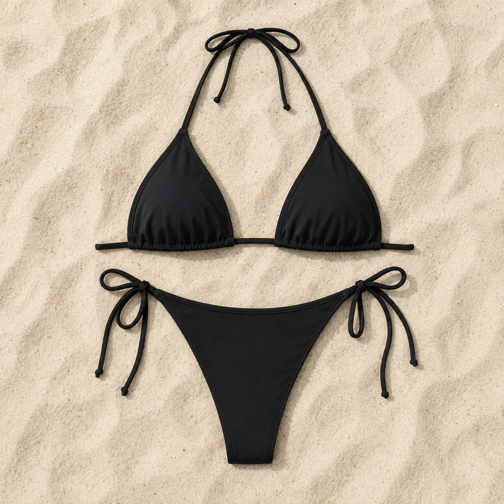Flat lay of the Fitfigura Strap Bikini – Minimal Form in black, featuring the bikini top and matching bottoms arranged on a neutral background.
