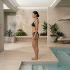 Side-angle poolside view of the black Fitfigura Strap Bikini – Minimal Form, showing the slim side shape and clean design.