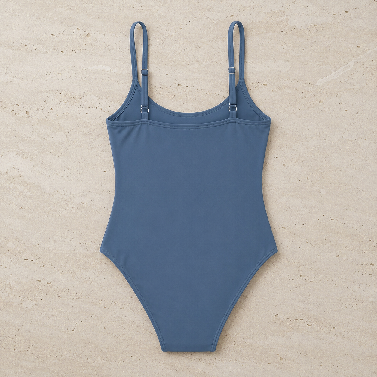 Flat lay back view of the Fitfigura Strap One-Piece – Minimal Form in blue, showing the open back shape and clean one-piece cut.