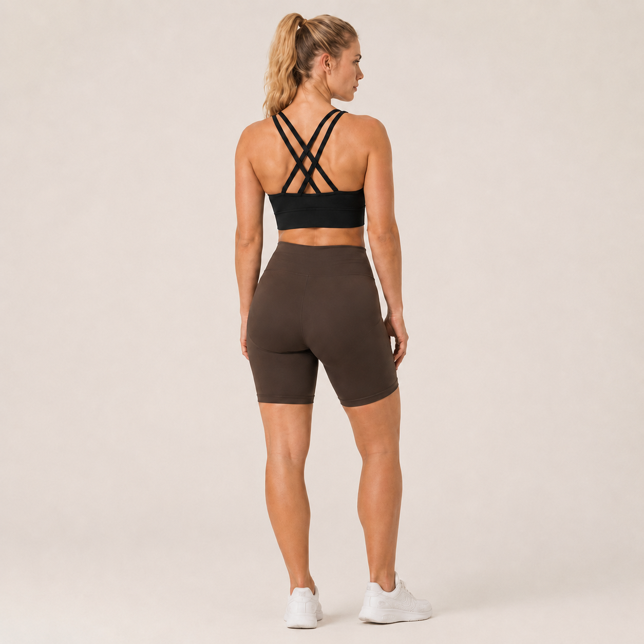Back view of the black Fitfigura Studio Bra – Soft Flow, showing the multi-strap back design and secure fit.