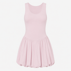 Flat lay of the Fitfigura Studio Dress – Soft Flow Form in light pink, showing the sleeveless neckline, fitted waist, and pleated skirt detail.