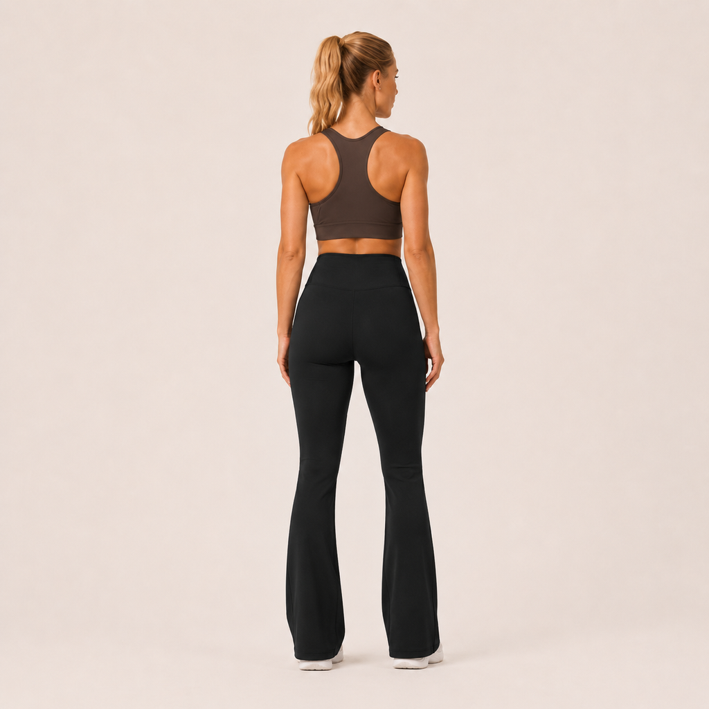 Back view of the black Fitfigura Studio High Waist Flare Pant – Fluid Motion Form, showing the streamlined rear fit and flare-leg silhouette.