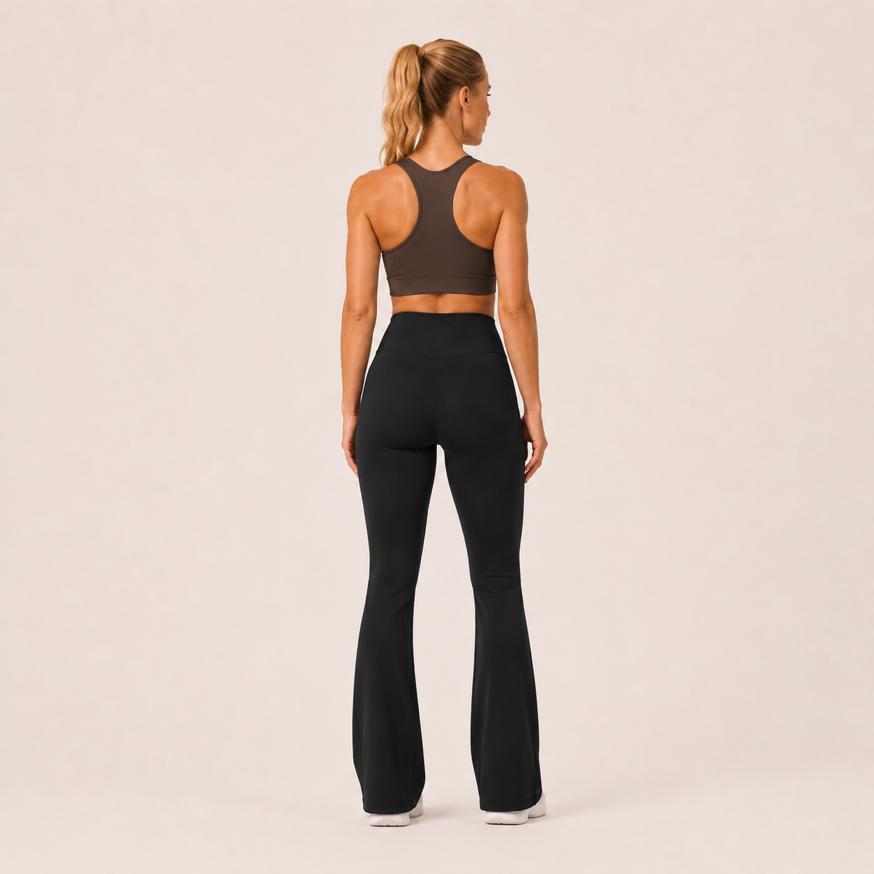Back view of the black Fitfigura Studio High Waist Flare Pant – Fluid Motion Form, showing the streamlined rear fit and flare-leg silhouette.
