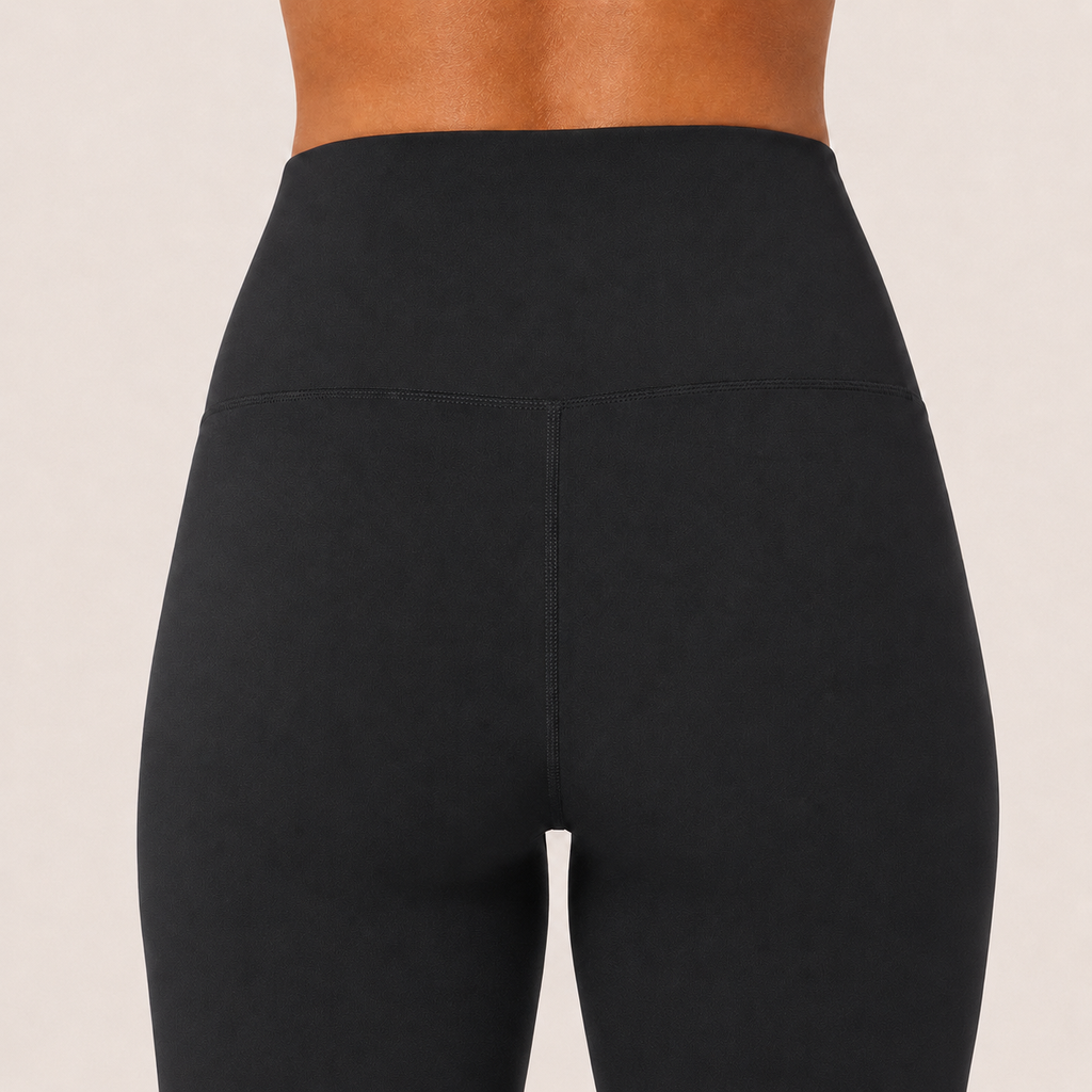 Close-up of the black Fitfigura Studio High Waist Flare Pant – Fluid Motion Form showing the high waistband and smooth sculpting fit.