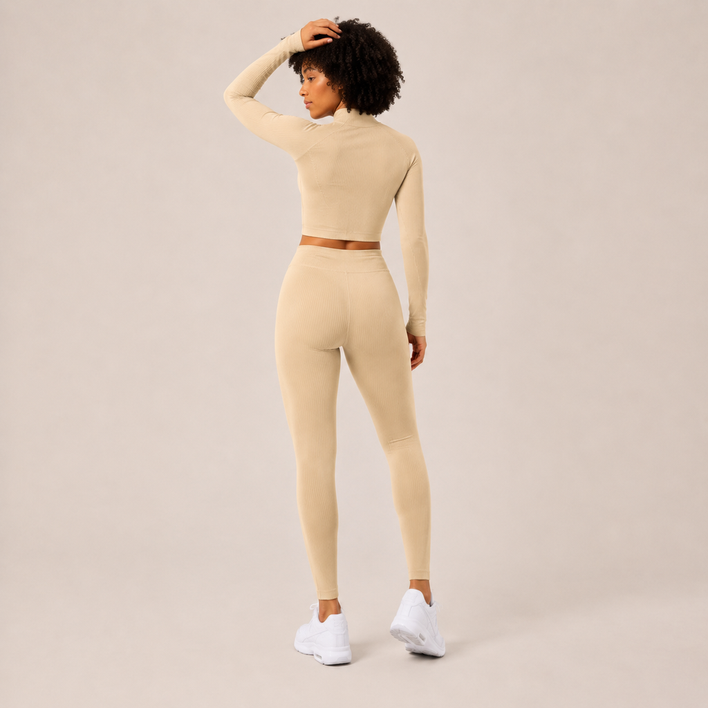 Rear angled view of the cream Fitfigura Studio Set – Soft Flow Form, highlighting the sculpted fit and soft movement design.