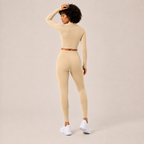Rear angled view of the cream Fitfigura Studio Set – Soft Flow Form, highlighting the sculpted fit and soft movement design.
