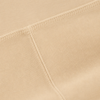 Close-up of the cream fabric and seam detail used in the Fitfigura Studio Short 8” – Flow Essential Form.