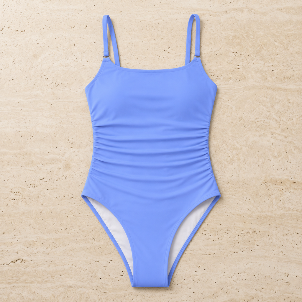 Flat lay front view of the blue Fitfigura Support One-Piece – Performance Form, showing the wide straps, scoop neckline, and ruched body detail.