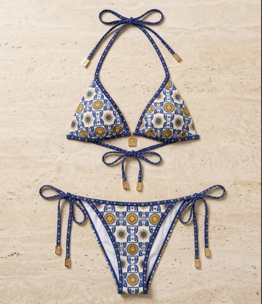 Flat lay of the Fitfigura Triangle Bikini – Classic Form in blue patterned print, featuring a tie-neck triangle top and matching tie-side bikini bottoms.