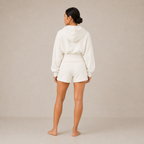 Back view of the Sculpt Hoodie – Structured Form with matching shorts, showing the hood and rear silhouette.