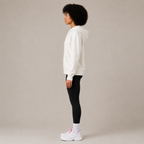 Side view of the Zip Hoodie – Utility Form showing the hood, sleeve length, and relaxed fit.